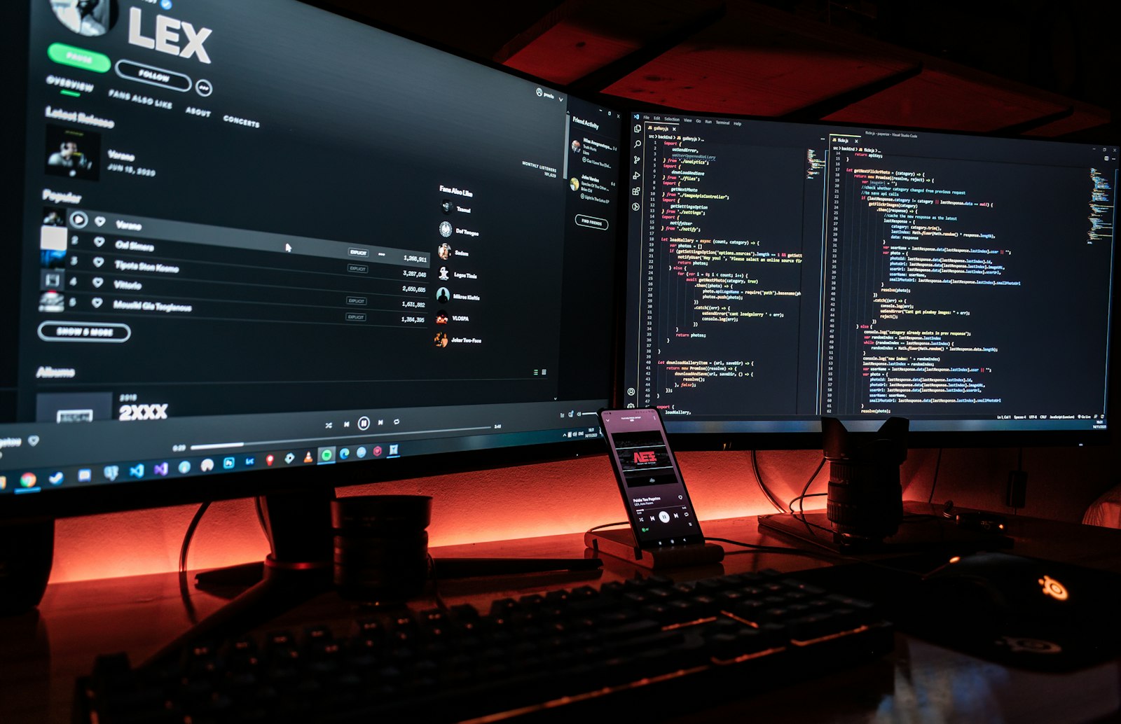 Multi-monitor desktop workstation at night